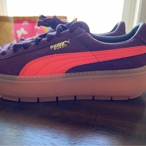 Purple and orange Pumas